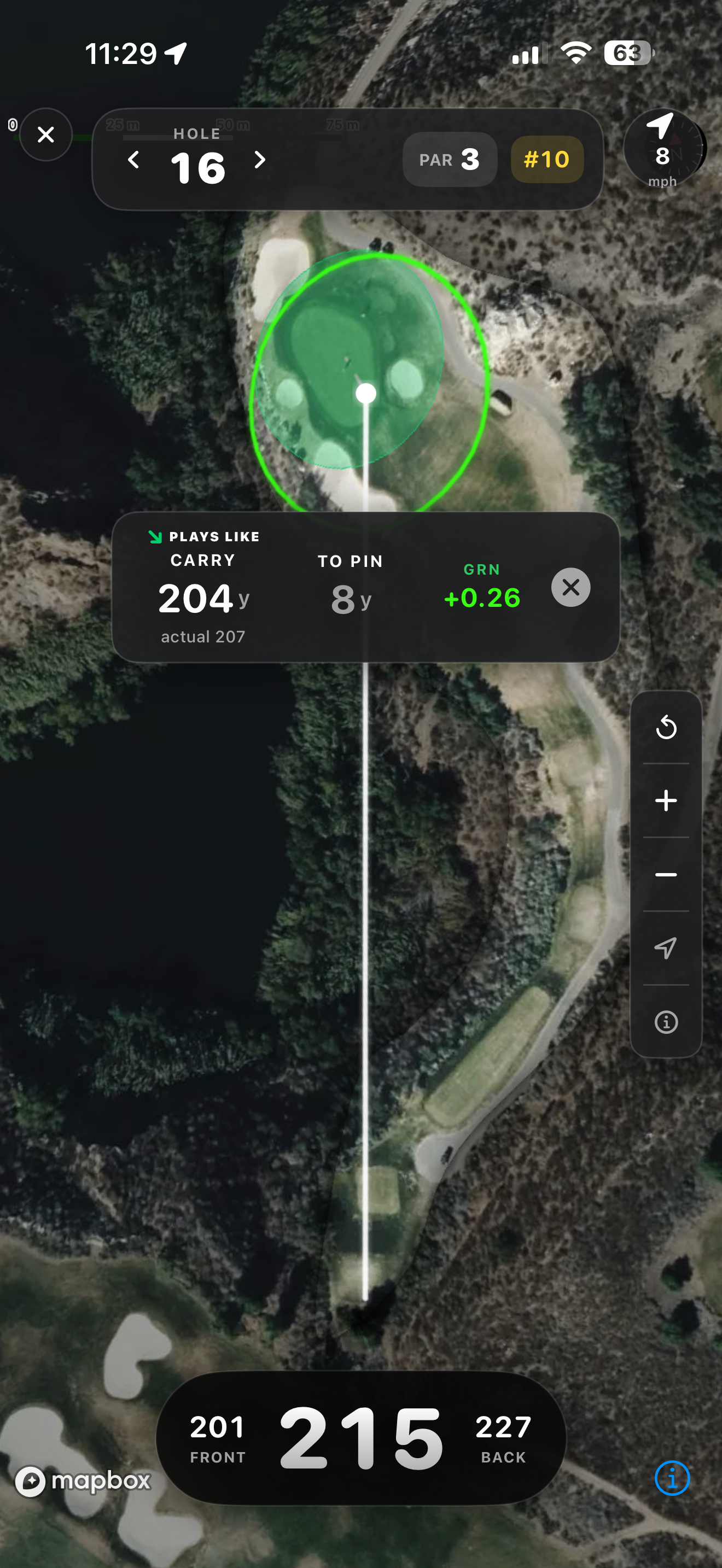 Satellite hole map of a par 3 over water, hole 16, par 3, handicap #10, wind 8 mph. A large green with bunkers is highlighted at the top with a target ring around it and a ball marker on the putting surface. A card reads PLAYS LIKE CARRY 204 yards with actual 207 underneath, TO PIN 8 yards, and GRN plus 0.26. The bottom bar reads 201 FRONT, 215 in large type, 227 BACK.